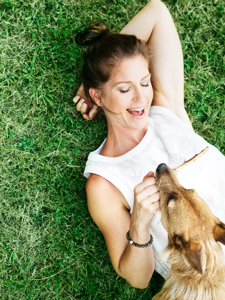 Marissa and Riley on the grass at golden hour.